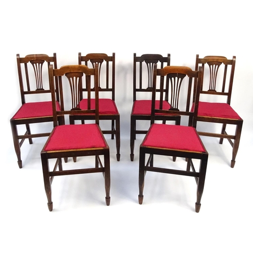 25 - Set of six walnut dining chairs with red upholstered seats