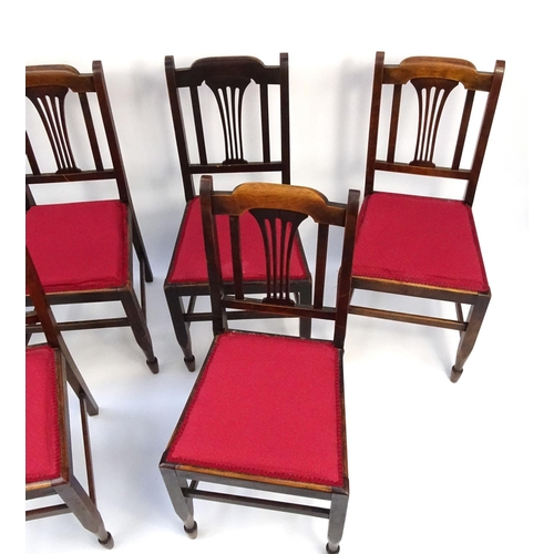 25 - Set of six walnut dining chairs with red upholstered seats