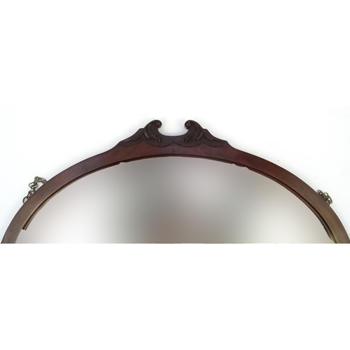 314 - Carved mahogany oval mirror with bevelled plate, 83cm x 63cm