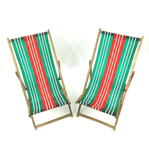 77 - Pair of vintage folding wooden deckchairs