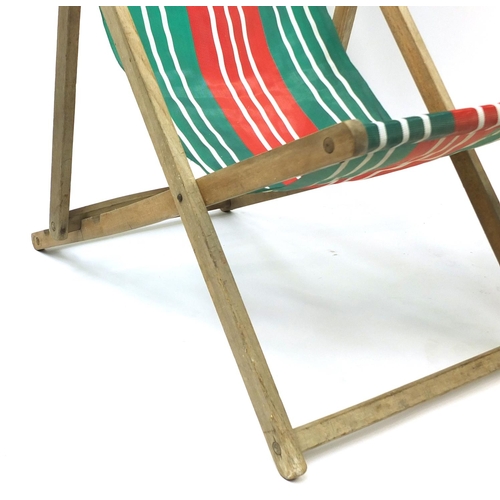 77 - Pair of vintage folding wooden deckchairs