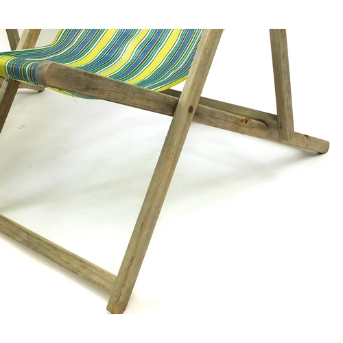 76 - Pair of vintage folding wooden deckchairs