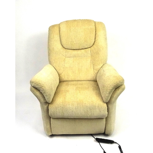 32 - Cream upholstered electric reclining armchair