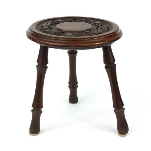 37 - Carved mahogany tripod stool engraved 1906, 32cm high, 29cm in diameter