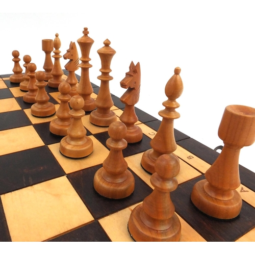 536 - Wooden chess set with folding board case, the largest piece 10cm high