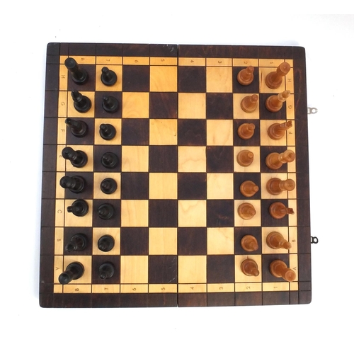 536 - Wooden chess set with folding board case, the largest piece 10cm high