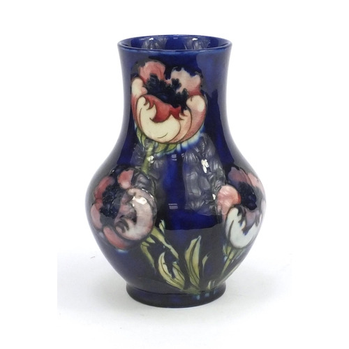 714 - Moorcroft Anemone pattern baluster vase, onto a blue ground, signed and impressed factory marks to t... 