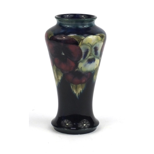 713 - Moorcroft pansy pattern vase, onto a blue ground, factory marks and M72 to the base, 18cm high