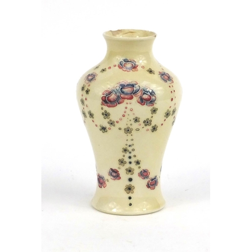 715 - Moorcroft for Liberty & Co baluster vase hand painted and tube lined with flowers, factory marks to ... 