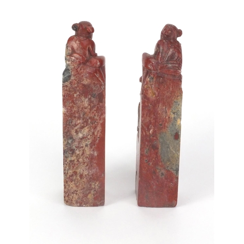 578 - Pair of Chinese soapstone seals, each carved with two elders, each 16cm high