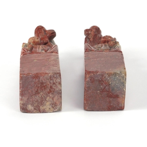 578 - Pair of Chinese soapstone seals, each carved with two elders, each 16cm high