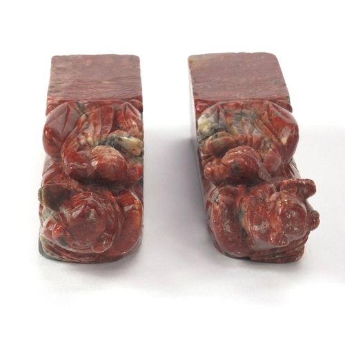 578 - Pair of Chinese soapstone seals, each carved with two elders, each 16cm high