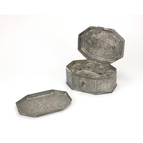 624 - Omani silver coloured metal spice box of hexagonal form, hinged lid opening to reveal a lift out tra... 