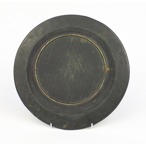 570 - Chinese bronze shallow dish with script, 24cm in diameter