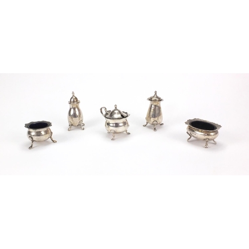 856 - Five silver cruet items comprising two open salts, mustard with hinged lid and two castors, various ... 