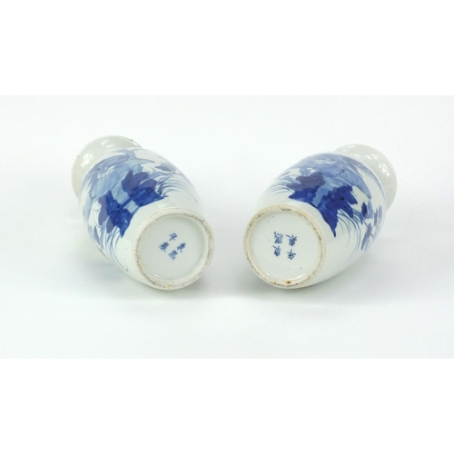 499 - Pair of Chinese blue and white porcelain baluster shaped vases, both hand painted with birds and but... 