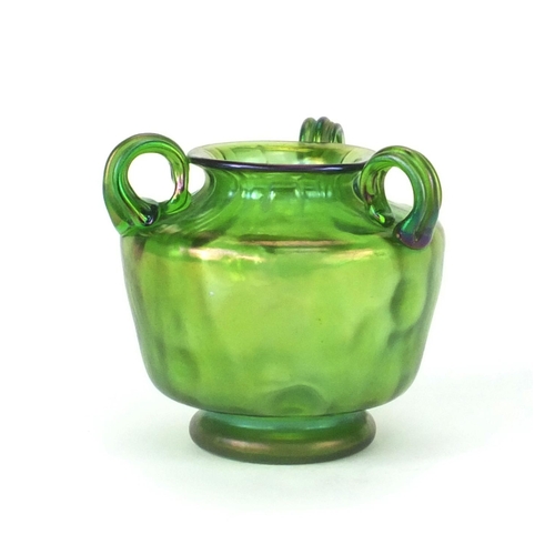 706 - Iridescent green glass vase with thee loop handles, 11cm high