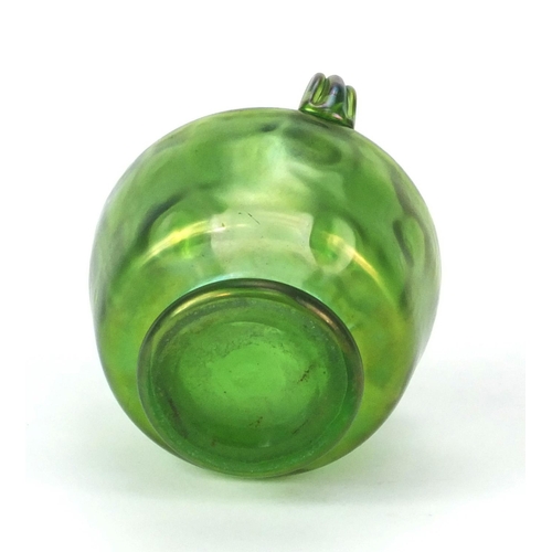 706 - Iridescent green glass vase with thee loop handles, 11cm high