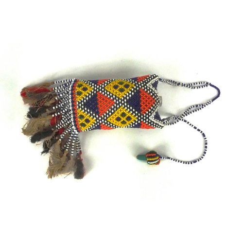 632 - African beadwork and glass flask with stopper decorated with a geometric design, 15cm in length excl... 