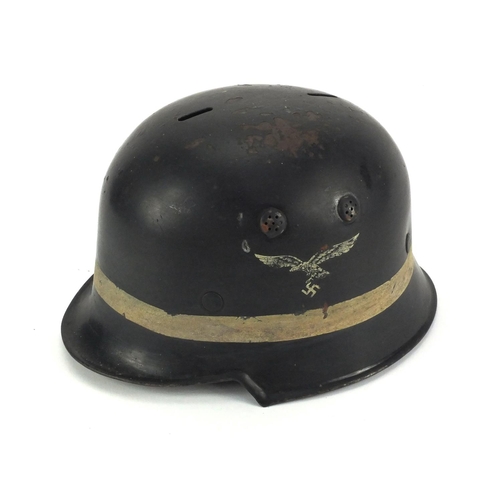 292 - German Military interest Luftwaffe fireman's helmet with decals and stamp to the interior