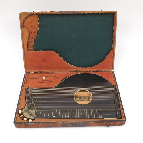 237 - 19th century rosewood and ivory zither by Anton Kiendl, with floral chased mounts and fitted case, l... 