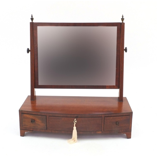 2084 - Regency mahogany swing mirror with three bow fronted drawers, 56cm high