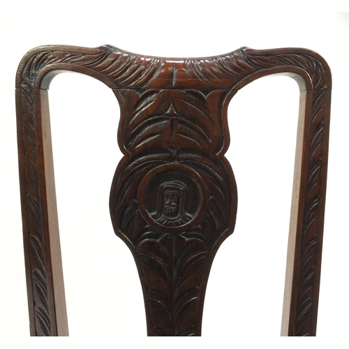 2071 - Antique oak hall chair, the splat carved with a figure and lozenge carved seat, 97cm high