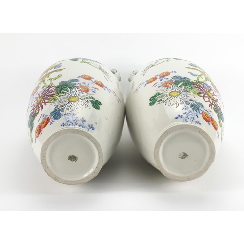 2218 - Large pair of Royal Nippon vases both with twin handles, hand painted with birds amongst flowers, fa... 