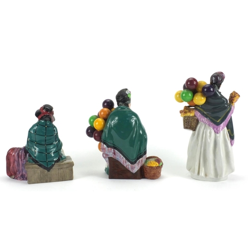 2339 - Three Royal Doulton figurines comprising Silks and Ribbons HN2017, The old Balloon Seller HN 1315 an... 