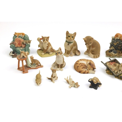 2190 - Sherrat & Simpson cats including on a chest of drawers and in a wheelbarrow, the largest 18cm high