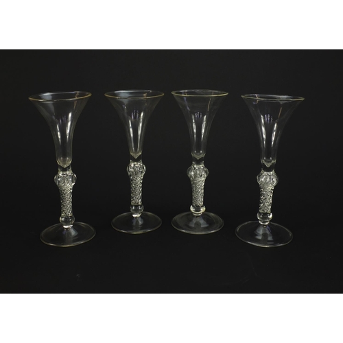 2224 - Four antique style glass vases with air twist stems, each 19cm high