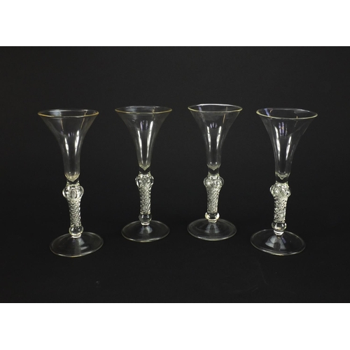 2224 - Four antique style glass vases with air twist stems, each 19cm high