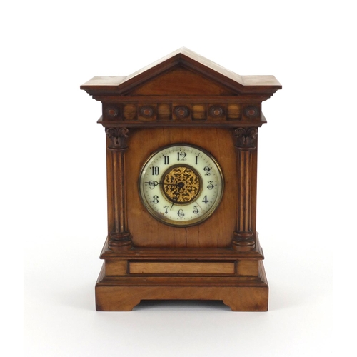 2167 - Edwardian walnut mantle clock with enamelled dial and Arabic numerals, the movement stamped R & Co P... 