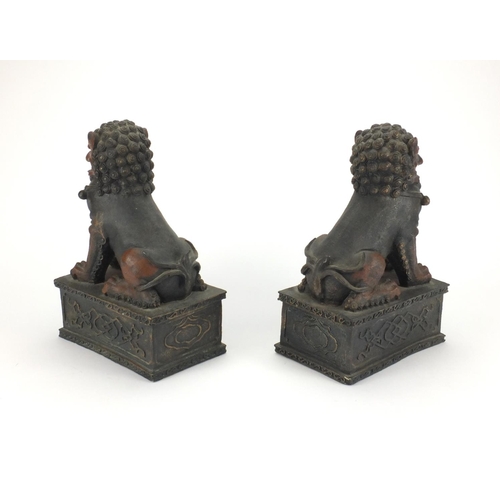 2316 - Pair of Chinese buddhistic lions on rectangular bases, each 31.5cm high