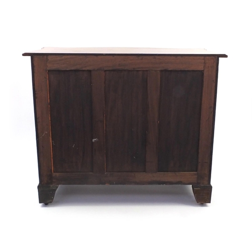 2001 - Georgian mahogany serpentine fronted chest fitted with four graduated drawers with canted corners on... 