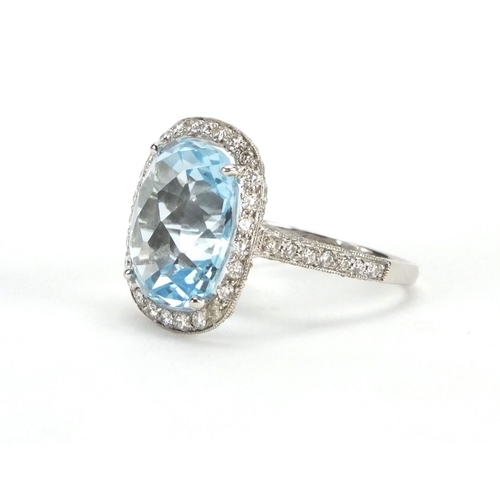 940 - Platinum blue topaz and diamond ring, size L, approximate weight 7.0g