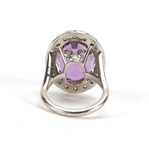 912 - 18ct white gold amethyst and diamond cocktail ring, size N, approximate weight 12.7g