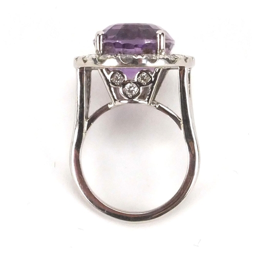 912 - 18ct white gold amethyst and diamond cocktail ring, size N, approximate weight 12.7g