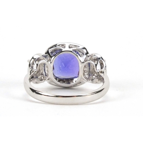 922 - 18ct white gold tanzanite and diamond ring, size N, approximate weight 4.4g