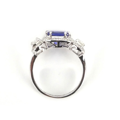 922 - 18ct white gold tanzanite and diamond ring, size N, approximate weight 4.4g