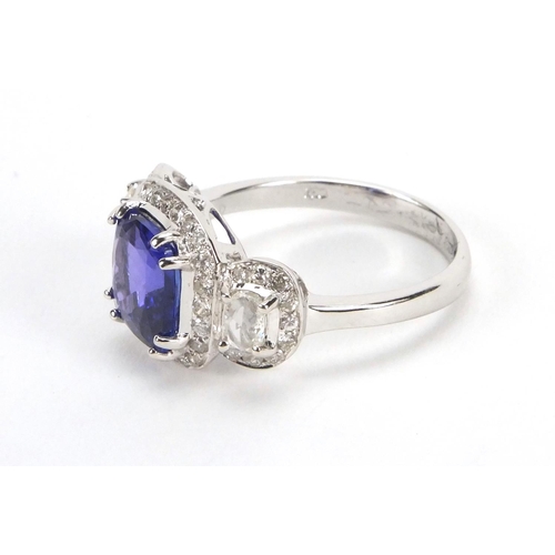 922 - 18ct white gold tanzanite and diamond ring, size N, approximate weight 4.4g