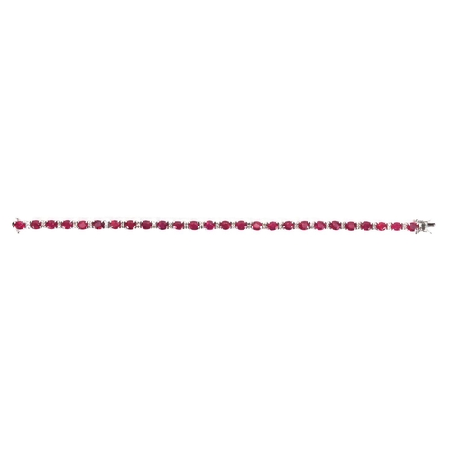 904 - 18ct white gold ruby and diamond bracelet, 18cm long, approximate weight 9.8g, boxed