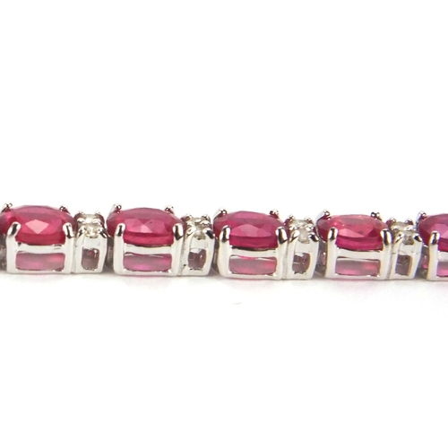 904 - 18ct white gold ruby and diamond bracelet, 18cm long, approximate weight 9.8g, boxed