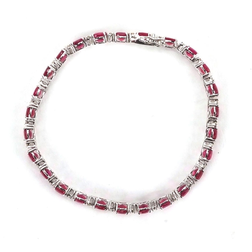 904 - 18ct white gold ruby and diamond bracelet, 18cm long, approximate weight 9.8g, boxed