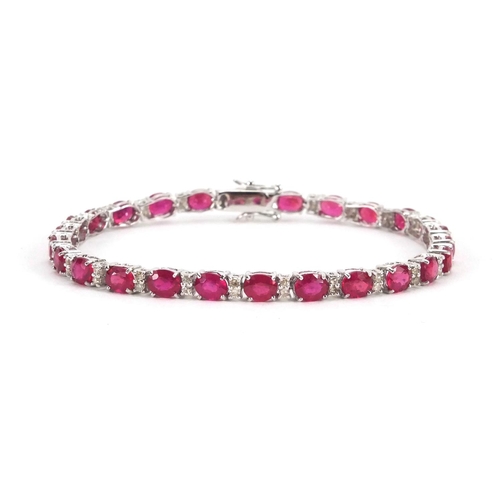 904 - 18ct white gold ruby and diamond bracelet, 18cm long, approximate weight 9.8g, boxed