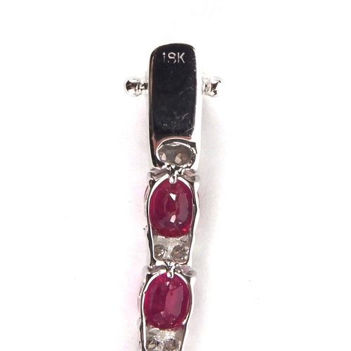 904 - 18ct white gold ruby and diamond bracelet, 18cm long, approximate weight 9.8g, boxed