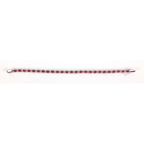 904 - 18ct white gold ruby and diamond bracelet, 18cm long, approximate weight 9.8g, boxed