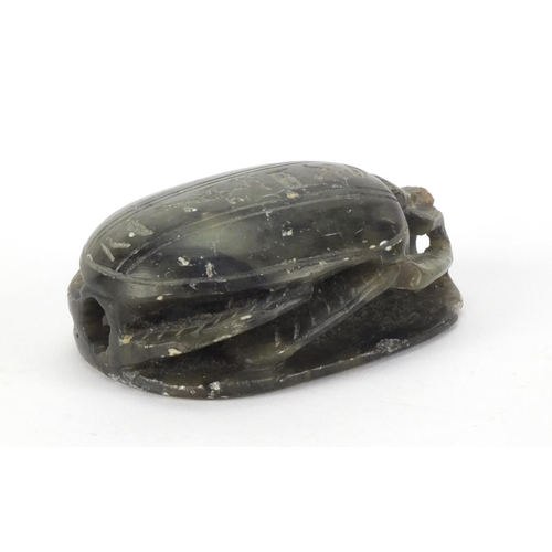 635 - Egyptian hard stone scarab beetle carved with hieroglyphics, 8.5cm in length