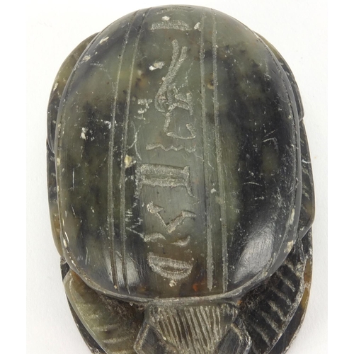 635 - Egyptian hard stone scarab beetle carved with hieroglyphics, 8.5cm in length