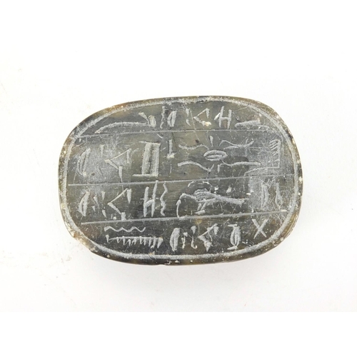 635 - Egyptian hard stone scarab beetle carved with hieroglyphics, 8.5cm in length